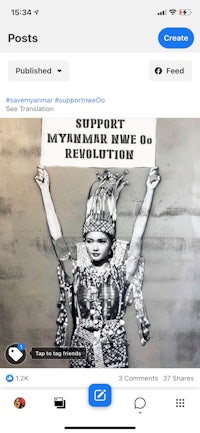a picture of a woman holding up a poster